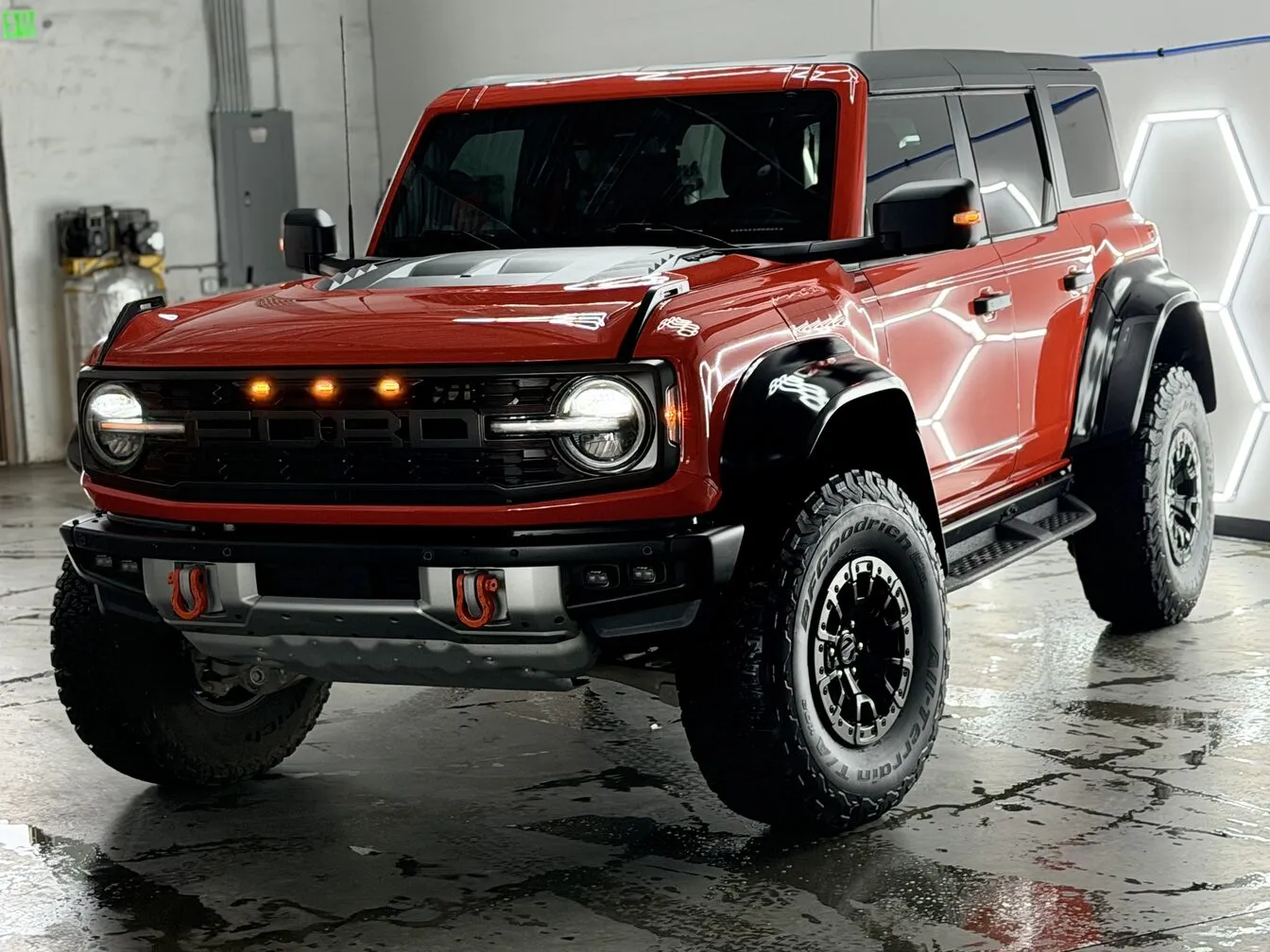 A red Ford Bronco Raptor inside the Ride N' Shine studio