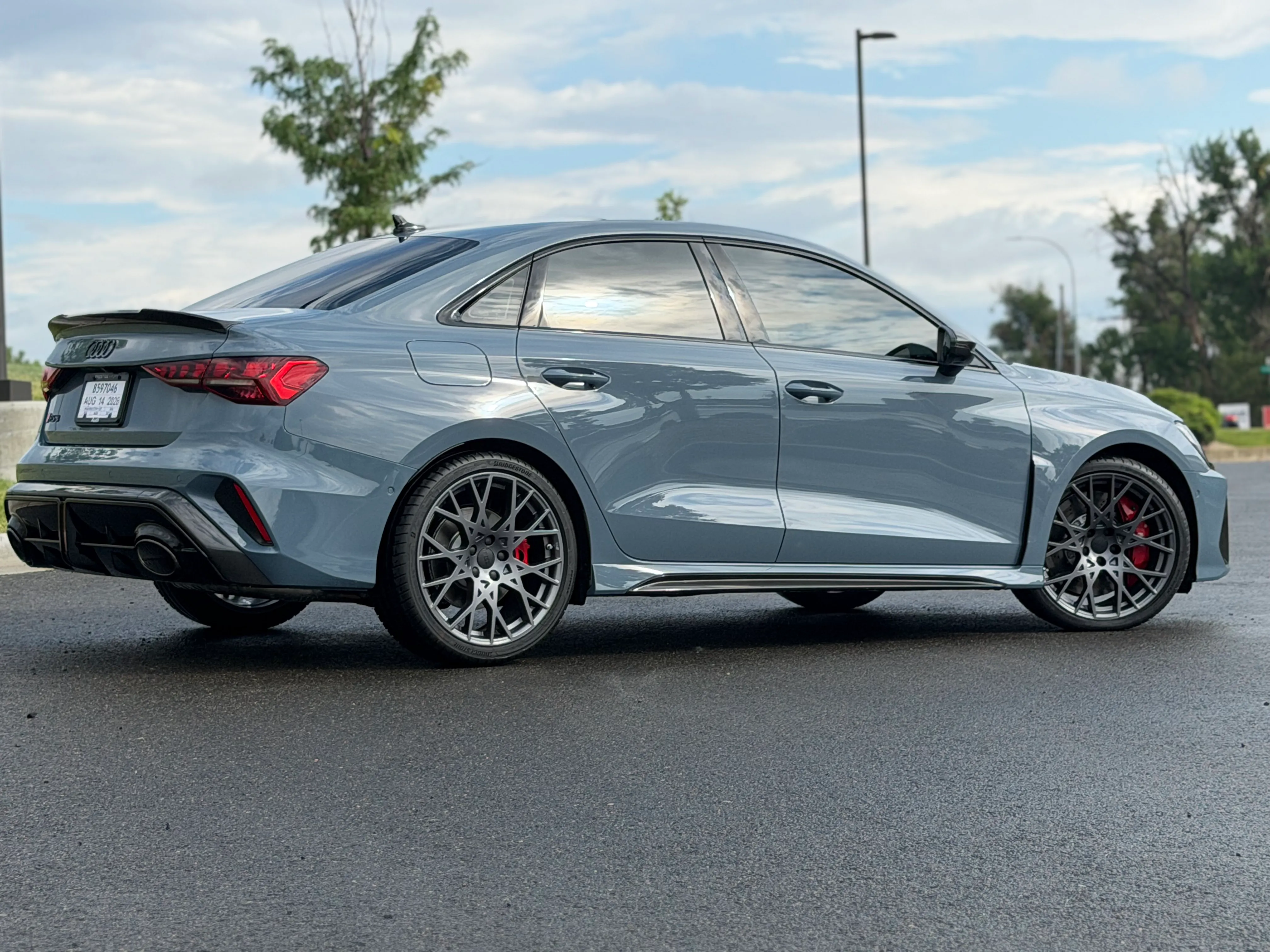 The rear quarter of a grey Audi RS3 showing the ceramic coating's finish