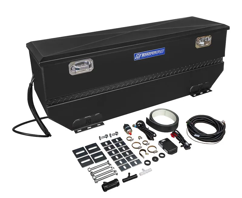 A black TransferFlow auxiliary fuel tank and toolbox combination with its mounting hardware and wiring laid out beside it